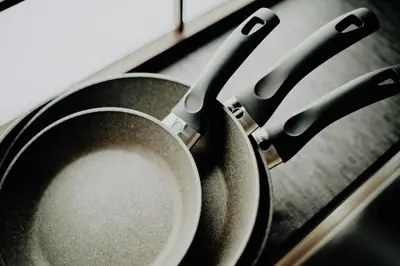 a frying pan on top of a stove at Hazama in Tokyo
