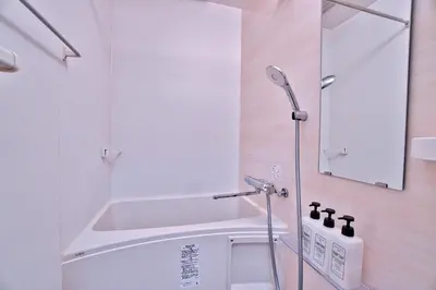 a white bathroom with a shower and a sink at Mjk 201 8min Inaricho 11min Ueno Max 3 in Tokyo