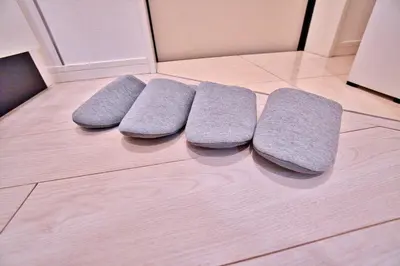 a row of four pillows on a kitchen floor at Mjk 201 8min Inaricho 11min Ueno Max 3 in Tokyo