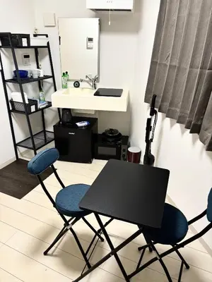 a bathroom with two chairs and a table and a sink at #45#46 2-factor authentication Shinjuku in Tokyo
