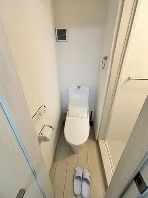 a bathroom with a toilet and a pair of slippers at #45#46 2-factor authentication Shinjuku in Tokyo