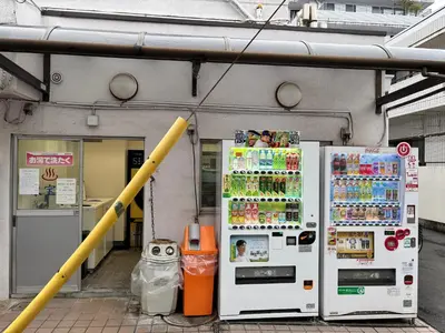 two refrigerators are parked in front of a building at #45#46 2-factor authentication Shinjuku in Tokyo