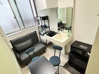 a small room with a sink and a desk and chairs at #45#46 2-factor authentication Shinjuku in Tokyo