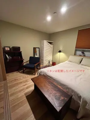 a bedroom with a bed and a chair and a desk at Cozy 65m2 Apartment including 20m2 Loft for one month stay and longer in Tokyo