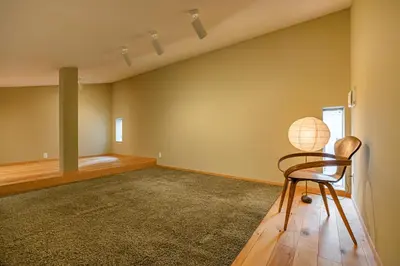 an empty room with a chair and a globe at Cozy 65m2 Apartment including 20m2 Loft for one month stay and longer in Tokyo