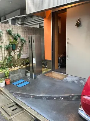 an open door of a house with a garage at Cozy 65m2 Apartment including 20m2 Loft for one month stay and longer in Tokyo