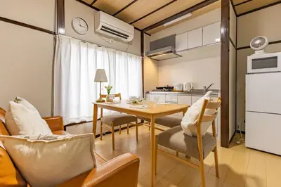 a kitchen and dining room with a table and chairs at Cozy Japanese House in Sumida 2BR Direct to Narita in Tokyo