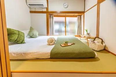 a bedroom with a bed with a tray on it at Cozy Japanese House in Sumida 2BR Direct to Narita in Tokyo