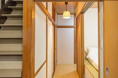a small apartment with a staircase and a bedroom at Cozy Japanese House in Sumida 2BR Direct to Narita in Tokyo