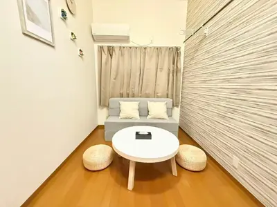 a small room with a white table and two stools at Shinjuku \u9ad8\u7530\u99ac\u5834\u30c6\u30e9\u30ce\u30d0B5 in Tokyo