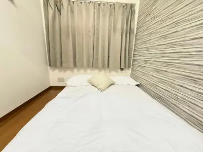 a bed in a room with a large window at Shinjuku \u9ad8\u7530\u99ac\u5834\u30c6\u30e9\u30ce\u30d0B5 in Tokyo