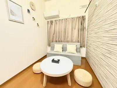 a small living room with a couch and a table at Shinjuku \u9ad8\u7530\u99ac\u5834\u30c6\u30e9\u30ce\u30d0B5 in Tokyo
