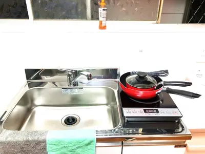 a kitchen sink with a pot on a stove at 4mins from sky tree Sumida area 3rooms Wifi in Tokyo
