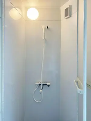 a shower in a bathroom with a glass door at Asakusa Sakura-4F in Tokyo