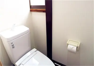a bathroom with a toilet and a roll of toilet paper at KIKI House2 in Tokyo