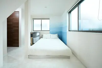 a bedroom with a bed in a room with a window at WANOYADO Tokyo - Shinjuku & Shibuya 8min - 3BR 81m2House - 10ppl - Family Friendly in Tokyo