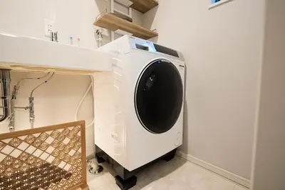 a washing machine is sitting in a bathroom at WANOYADO Tokyo - Shinjuku & Shibuya 8min - 3BR 81m2House - 10ppl - Family Friendly in Tokyo