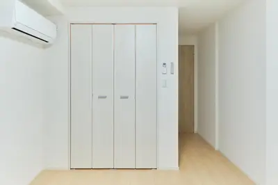 a white closet in a room with white walls at monthly akebonobashi in Tokyo