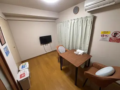 a room with a table and chairs and a television at S,F, Heights - Vacation STAY 19865 in Tokyo