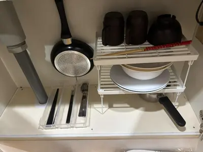 a kitchen shelf with various kitchen utensils on it at S,F, Heights - Vacation STAY 19865 in Tokyo