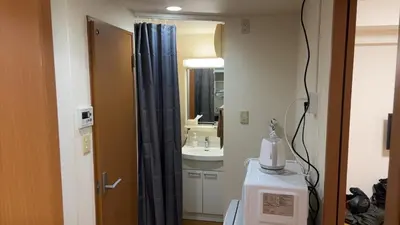 a bathroom with a sink and a mirror at S,F, Heights - Vacation STAY 19865 in Tokyo