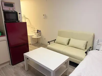 a small living room with a couch and a table at 2nd Narumitsu Building, Room 302 - Vacation STAY 24150v in Tokyo
