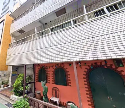 a brick building with two windows and a balcony at 2nd Narumitsu Building, Room 302 - Vacation STAY 24150v in Tokyo