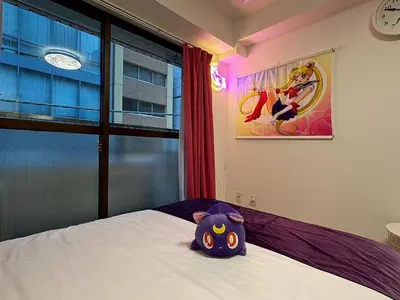a purple cat pillow sitting on top of a bed at 2nd Narumitsu Building, Room 302 - Vacation STAY 24150v in Tokyo