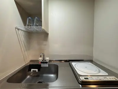 a small kitchen with a sink and a toilet at Dai2 Narumitsu Building 301 - Vacation STAY 29234v in Tokyo