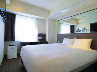 a bedroom with a large white bed and a window at Far East Village Hotel Tokyo Asakusa - Vacation STAY 46923v in Tokyo