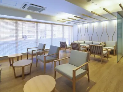 a waiting room with tables and chairs and windows at Far East Village Hotel Tokyo Asakusa - Vacation STAY 46931v in Tokyo