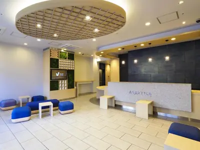 a lobby with a waiting room with blue chairs at Far East Village Hotel Tokyo Asakusa - Vacation STAY 46931v in Tokyo