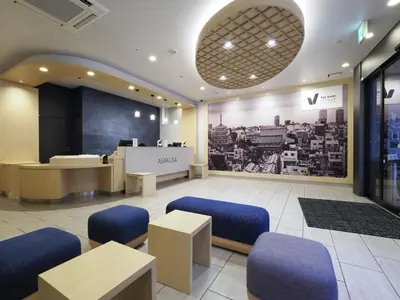a lobby with a waiting room with blue chairs at Far East Village Hotel Tokyo Asakusa - Vacation STAY 46938v in Tokyo