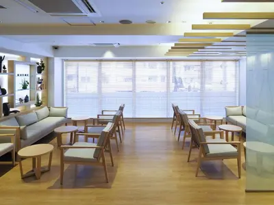 a waiting room with tables and chairs and windows at Far East Village Hotel Tokyo Asakusa - Vacation STAY 46944v in Tokyo