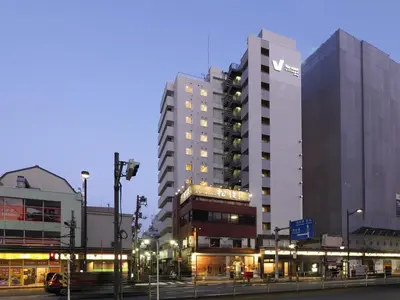 a tall building with a sign on the side of it at Far East Village Hotel Tokyo Asakusa - Vacation STAY 46946v in Tokyo