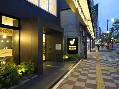 a building with a sign on the side of a street at Far East Village Hotel Tokyo Asakusa - Vacation STAY 46946v in Tokyo
