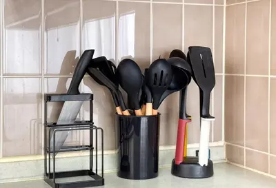 a container filled with utensils on a kitchen counter at \u671f\u9593\u9650\u5b9a \u6d45\u8349\u6a4b3floor in Tokyo