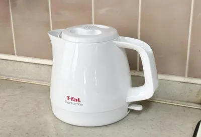 a white tea kettle sitting on a counter at \u671f\u9593\u9650\u5b9a \u6d45\u8349\u6a4b3floor in Tokyo