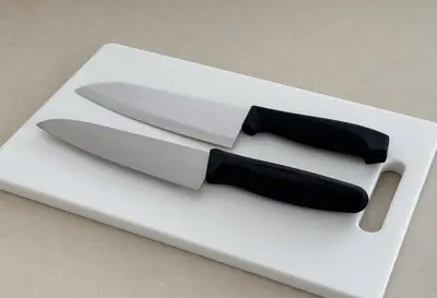 a knife sitting on top of a white cutting board at \u671f\u9593\u9650\u5b9a \u6d45\u8349\u6a4b4floor in Tokyo