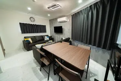 a living room with a table and a couch at \u5225\u90b8Zen\u5c0f\u5ca9 Bettei Zen Koiwa in Tokyo