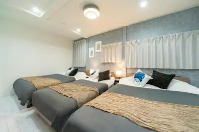 a room with four beds in a room at \u5225\u90b8Zen\u5c0f\u5ca9 Bettei Zen Koiwa in Tokyo