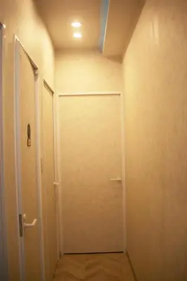 a door in a room with a hallway at aMIYAVI 2F in Tokyo