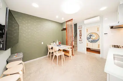 a dining room with a table and chairs at Spacious 3-Story House with 2 Baths, 7 min to Metro direct to Akihabara Ueno Ginza in Tokyo