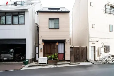 a house on the side of a street at Spacious 3-Story House with 2 Baths, 7 min to Metro direct to Akihabara Ueno Ginza in Tokyo