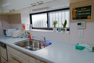 a kitchen counter with a sink and a window at Akira Hiro House - Room203 in Tokyo