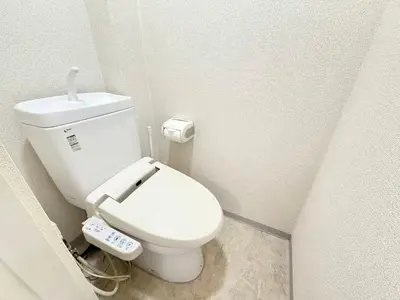a small bathroom with a white toilet in a room at Shinjuku Waseda B2 in Tokyo