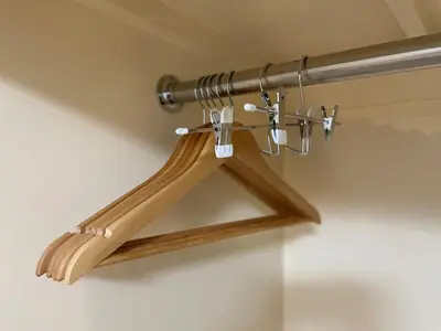 a wooden hanger with a metal rod on a ceiling at SORA Shibuya in Tokyo
