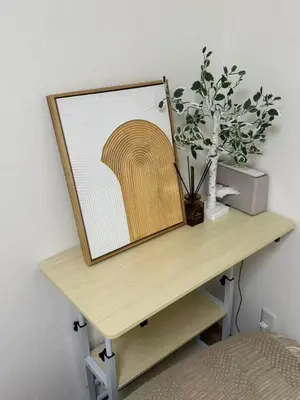 a table with a picture and a plant on it at 5-minute walk from Otsuka Station on the Yamanote Line, 20 square meters On the 3rd floor No elevator in Tokyo