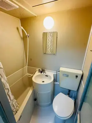 a small bathroom with a toilet and a sink at 5-minute walk from Otsuka Station on the Yamanote Line, 20 square meters On the 3rd floor No elevator in Tokyo