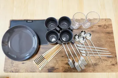 a table with a plate and utensils and wine glasses at Convertel Setagaya - Vacation STAY 45953v in Tokyo